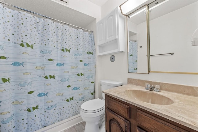 bathroom featuring curtained shower, vanity, and toilet