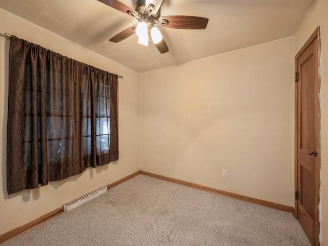 empty room with a baseboard heating unit, light carpet, ceiling fan, and baseboards