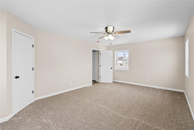 empty room with carpet and ceiling fan