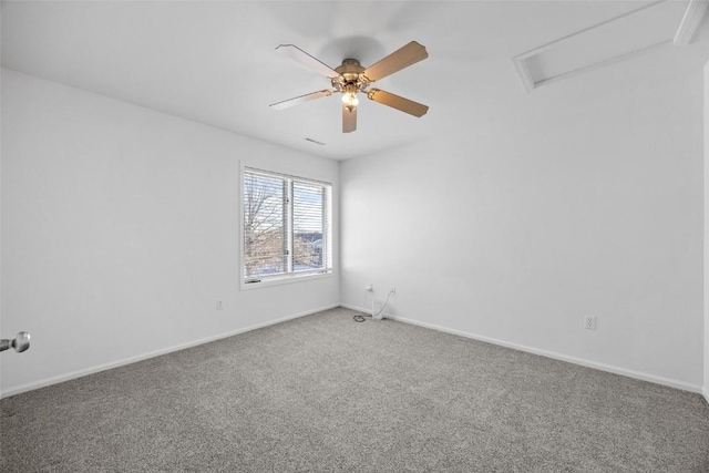 carpeted spare room featuring ceiling fan