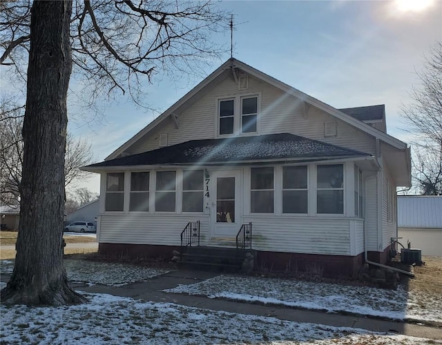 bungalow-style home featuring central air condition unit