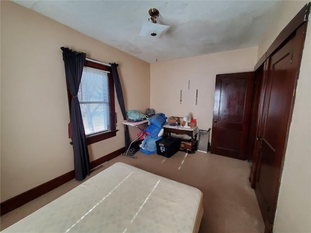 bedroom with light carpet