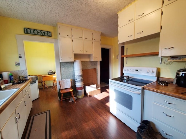 kitchen featuring white range with electric cooktop, dark hardwood / wood-style flooring, and white cabinets