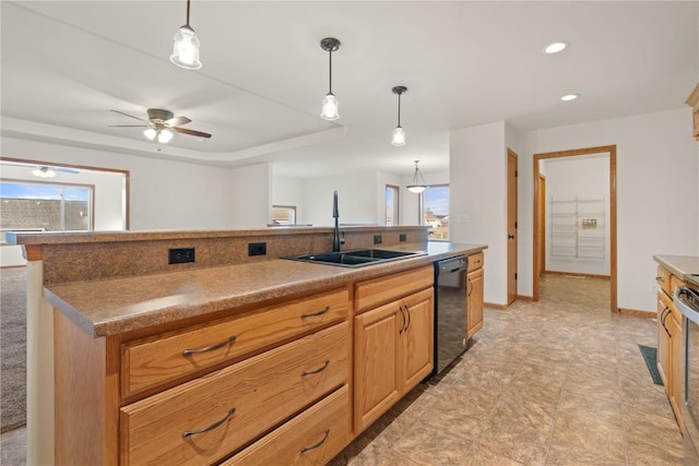 kitchen featuring ceiling fan, black dishwasher, sink, and a wealth of natural light