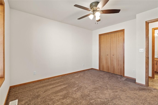 unfurnished bedroom featuring ceiling fan, carpet floors, and a closet