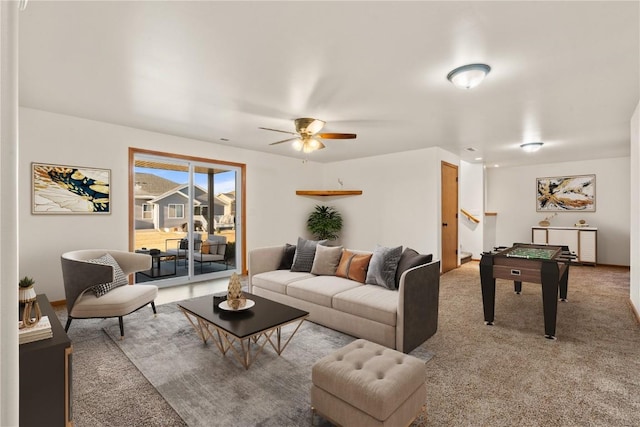 carpeted living room featuring ceiling fan