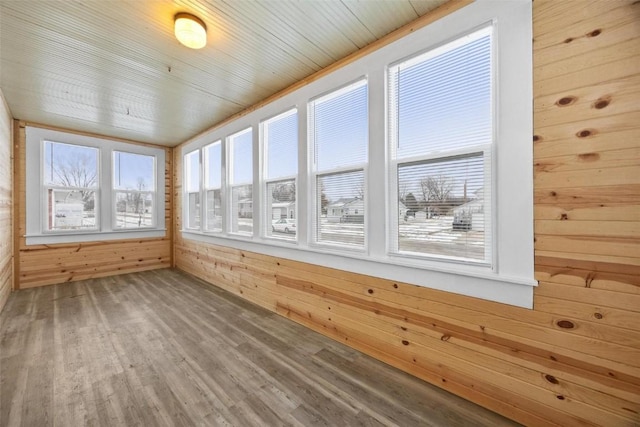 unfurnished sunroom with wooden ceiling