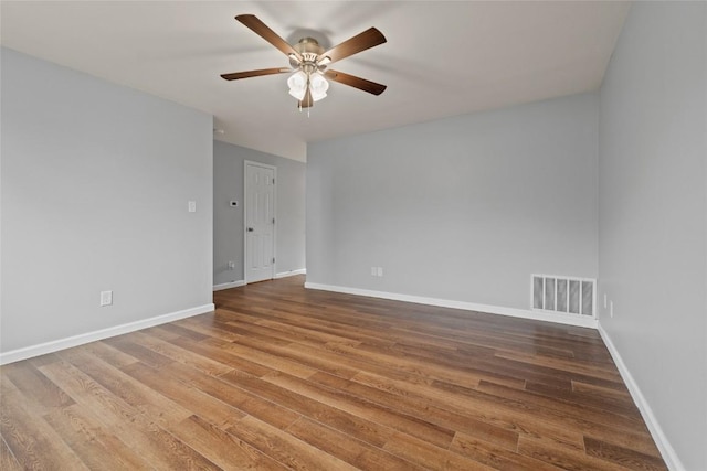 empty room featuring ceiling fan and wood-type flooring