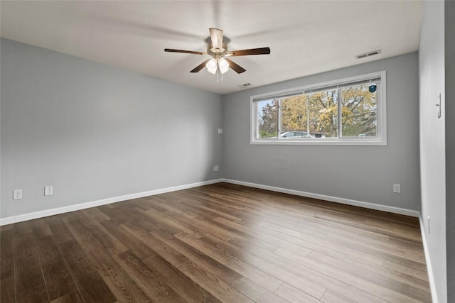 unfurnished room with hardwood / wood-style flooring and ceiling fan