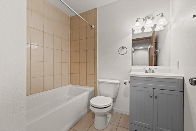 full bathroom featuring tile patterned flooring, vanity, toilet, and tiled shower / bath combo