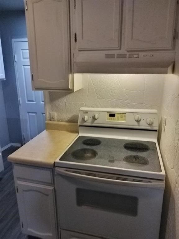 kitchen featuring white range with electric stovetop