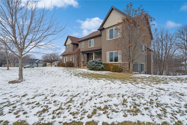 view of snow covered house