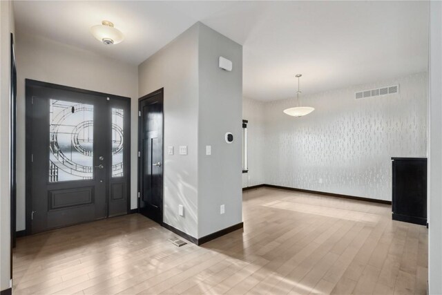 entrance foyer featuring wood-type flooring