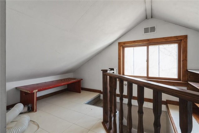 additional living space with vaulted ceiling