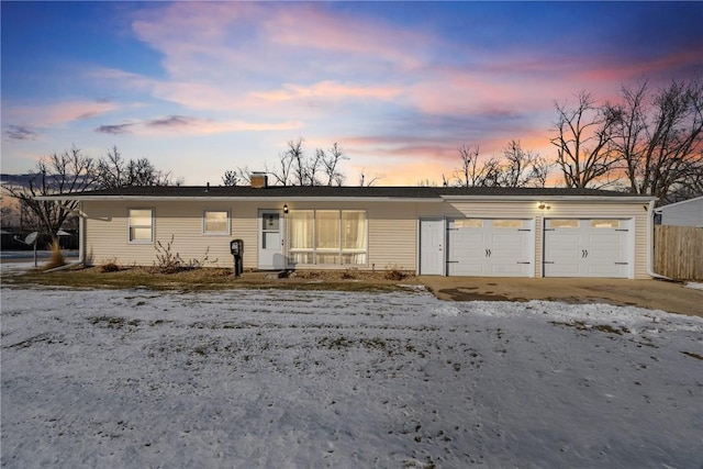 single story home featuring a garage