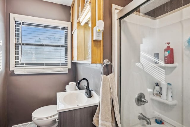 full bathroom with vanity, toilet, and enclosed tub / shower combo