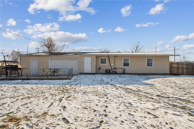 view of front of house featuring a wooden deck and a garage