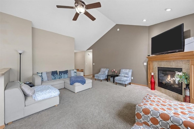 living room with carpet flooring, ceiling fan, lofted ceiling, and a fireplace