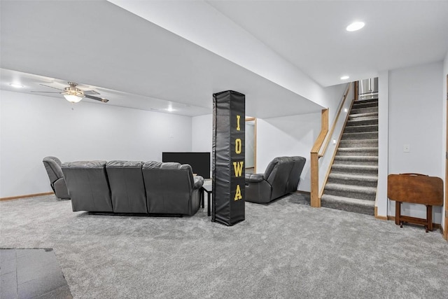 carpeted living room with ceiling fan