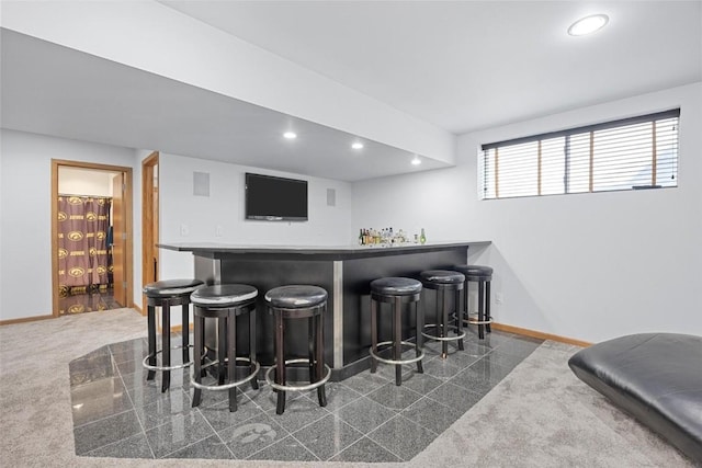 bar featuring dark colored carpet