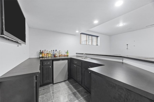 bar featuring dishwasher and sink