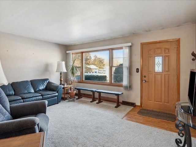 living room featuring light carpet