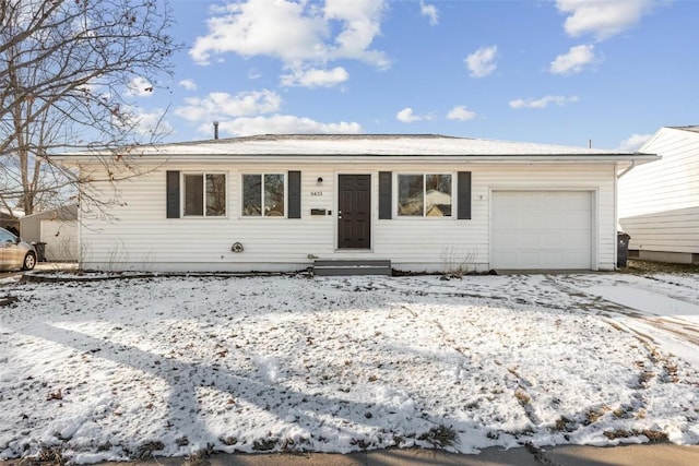 ranch-style house featuring a garage