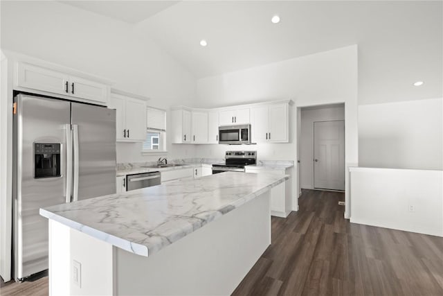 kitchen featuring white cabinets, appliances with stainless steel finishes, and a center island