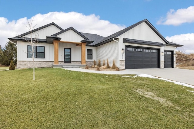 modern farmhouse style home with a front lawn and a garage