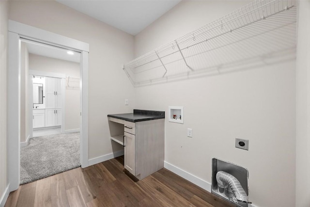 laundry room with hookup for a washing machine, dark hardwood / wood-style flooring, and electric dryer hookup