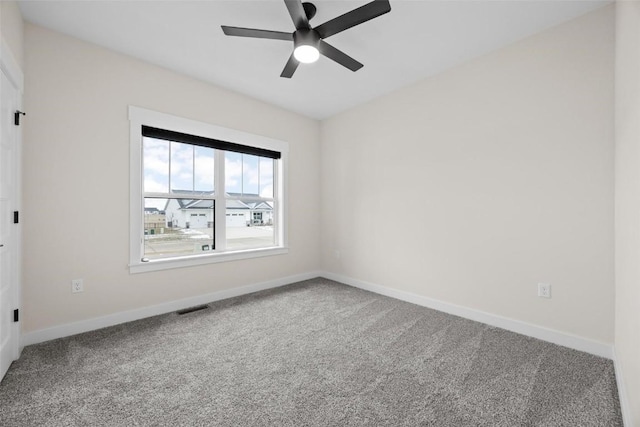 spare room with carpet flooring and ceiling fan