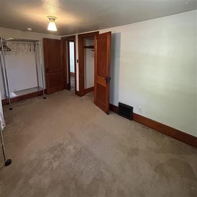 unfurnished bedroom featuring carpet flooring