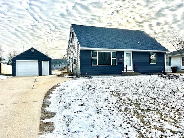 view of front of property featuring a garage and an outbuilding