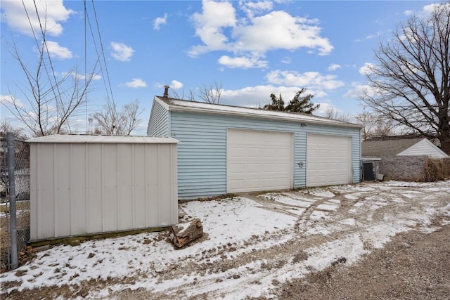 view of snow covered garage