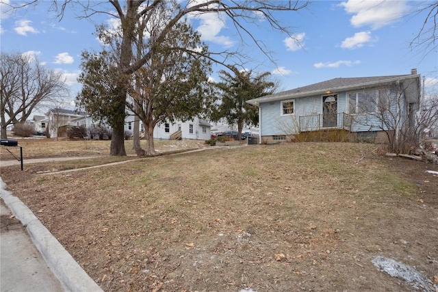 view of front of home with a front lawn