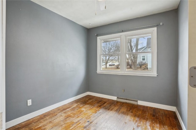 unfurnished room featuring hardwood / wood-style floors