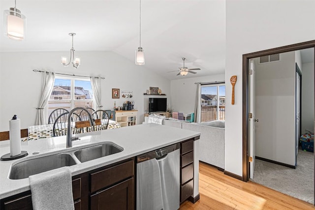 kitchen with dishwasher, sink, light hardwood / wood-style floors, decorative light fixtures, and ceiling fan with notable chandelier