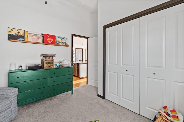 carpeted bedroom featuring a closet