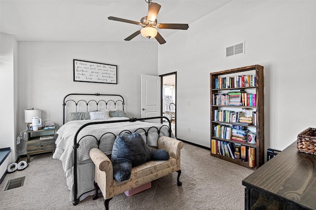 bedroom with ceiling fan, light carpet, and lofted ceiling