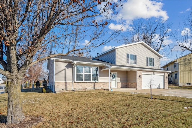 view of front of house featuring a front yard and a garage