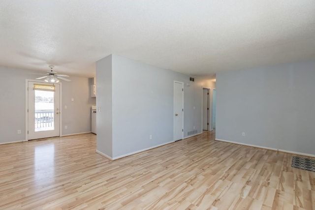 unfurnished room with ceiling fan and light hardwood / wood-style floors