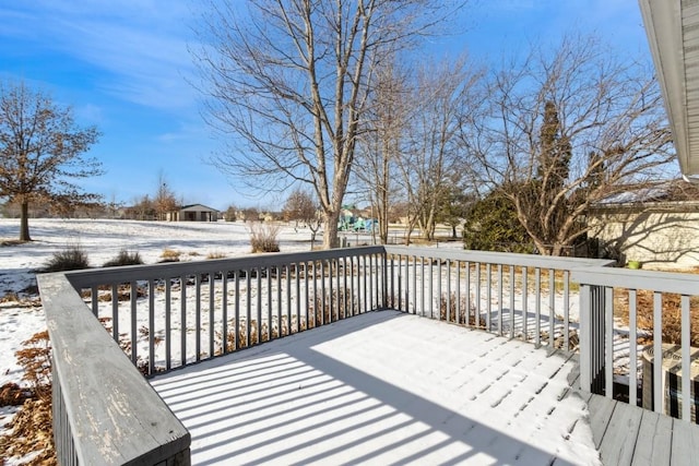 view of snow covered deck