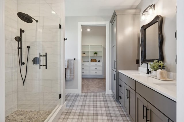 bathroom with vanity and a shower with shower door