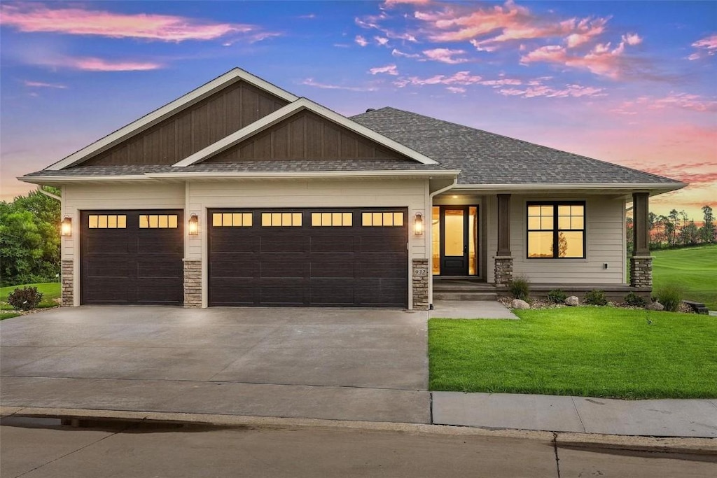 view of front of house with a lawn and a garage