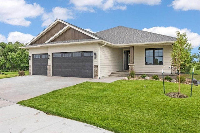 view of front facade with a front yard and a garage