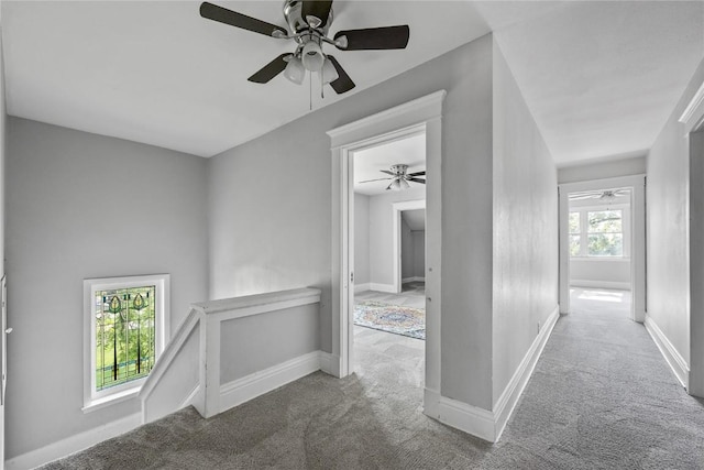 corridor with carpet flooring