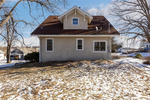 view of snow covered house