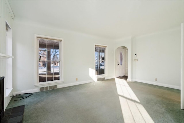 unfurnished living room with carpet flooring