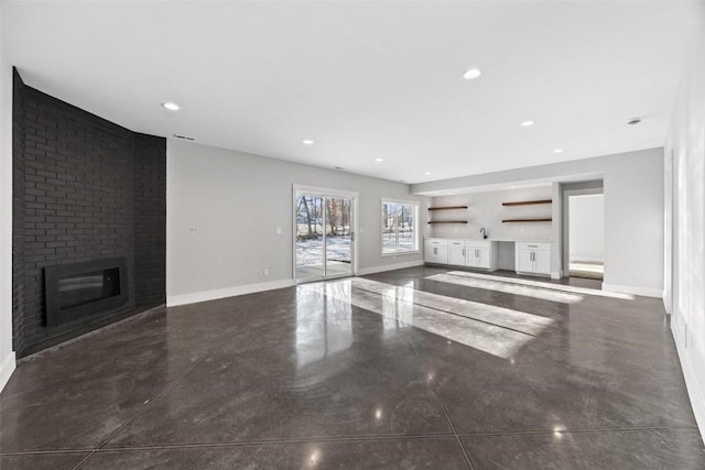 unfurnished living room with a fireplace