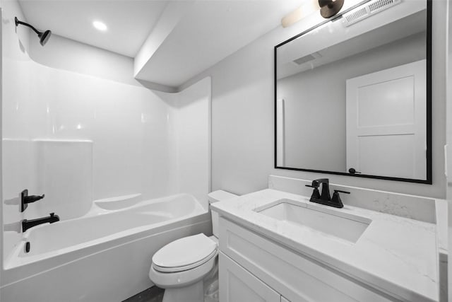 full bathroom featuring toilet, bathing tub / shower combination, and vanity